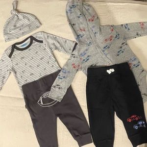 2 outfits 3-6 months - foot ball outfit is new - cars outfit was worn twice.